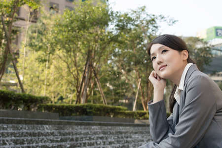 Asian business woman thinking in the city.の写真素材