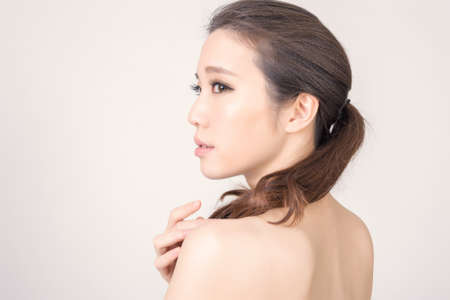 Asian beauty face closeup portrait with clean and fresh elegant lady. Studio shot.の写真素材