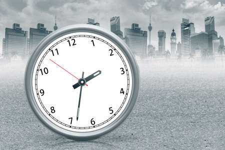 Clock standing on ground in a city.の写真素材