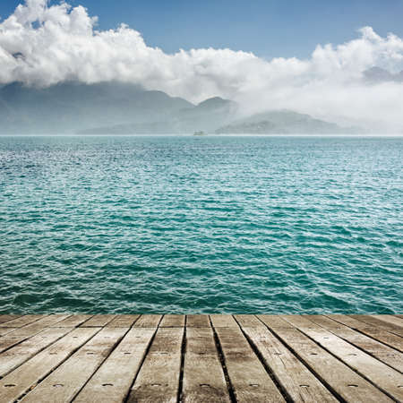 Landscape of beautiful lake with wooden ground.
