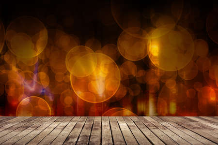 Wooden ground with city night scene and bokeh far away.