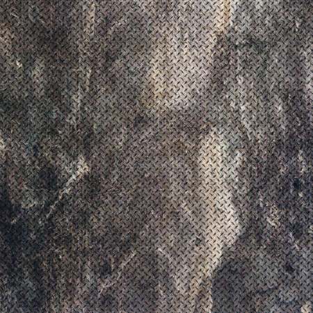 Background of metal diamond plate in grungy color.の写真素材