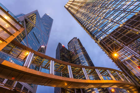 City night scene with modern bridge and skyscraper in Hong Kong, Asia.
