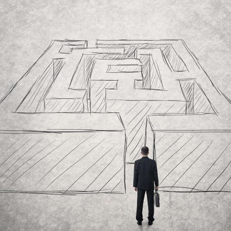 Businessman walk into a difficult maze.の写真素材