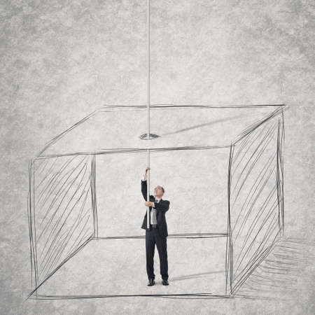 Concept of businessman escape from a box . の写真素材