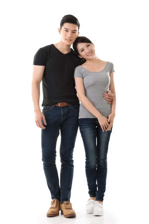Attractive young Asian couple, full length portrait isolated on white background.の写真素材