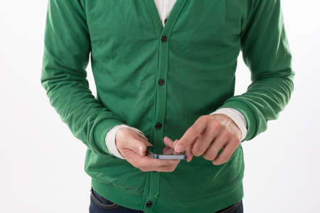 Closeup image of man using cellphone on white background.