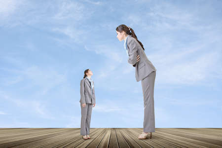 Asian businesswoman looking on her big version on the roof. Business growth concept.の写真素材