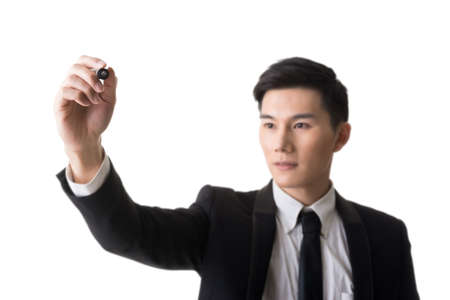 Asian businessman writing, closeup portrait on white background. Focus on hand.の写真素材