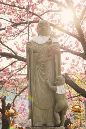 Japanese stone statue Ksitigarbha Bodhisattva in gardenのeditorial素材