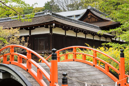 Orange arched bridge of Japanese temple garden in shimogamo-jinja, Kyoto, Japanのeditorial素材