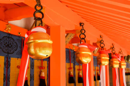 Japanese temple bells in Fushimi Inari Taisha Shrine, Kyoto, Japan の写真素材