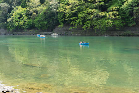 KYOTO, JAPAN - APRIL 26th  : Boats in Hozu(Katsuragawa)  River in Arashiyama in Kyoto, Japan on 26th April 2014.のeditorial素材