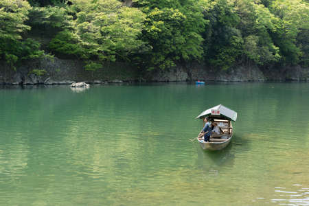 KYOTO, JAPAN - APRIL 26th  : The ferry of  Hozu(Katsuragawa) River in Arashiyama in Kyoto, Japan on 26th April 2014.のeditorial素材
