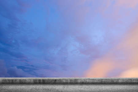 Background of concrete ground with cloudy sky.