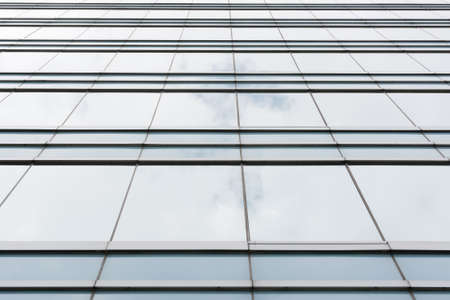 Office glass windows with beautiful reflection in Hong Kong, Asia.の写真素材