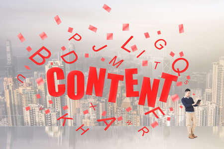 Concept of content, one Asian young guy use pad.の写真素材