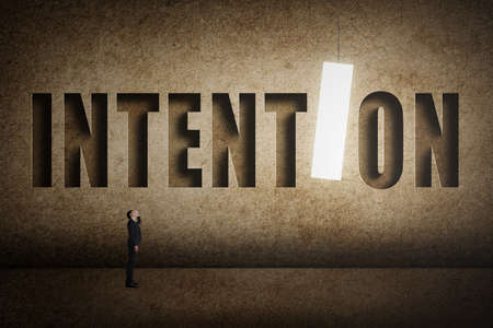 Concept of target, choice, decisioin etc with asian business man and 3D text on wall.の写真素材