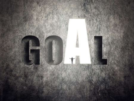 Concept of target, goal, will etc, man stand on wall with text.の写真素材