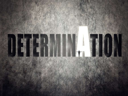 Concept of target, goal, will etc, man stand on wall with text.の写真素材