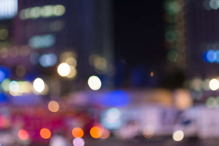 Abstract urban background with blurred buildings and street, shallow depth of focus.の写真素材