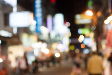 Abstract urban background with blurred buildings and street, shallow depth of focus.の写真素材