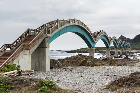 TAITUNG, TAIWAN - DEC 14th : Famous bridge at Sanxiantai, with many tourists on December 14th, 2014 in Chenggong Township, Taitung County, Taiwan, Asia.のeditorial素材