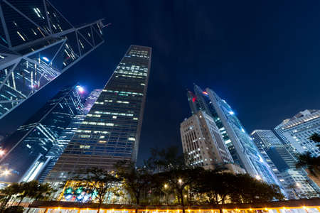 Hong Kong skyline in night with skyscrapers against sky.の写真素材