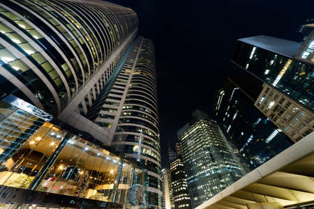 City night scene with business office skyscrapers in Hong Kong, China, Asia.の写真素材