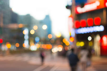Abstract urban background with blurred buildings and street, shallow depth of focus.の写真素材