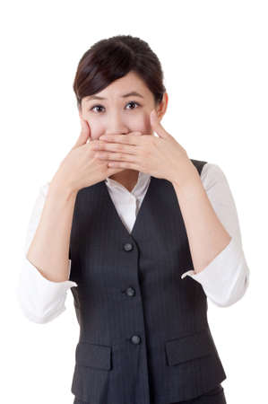 Business woman close her mouth by hand, closeup portrait on white background.の写真素材