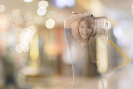 double exposure of shopping woman in the mall.の写真素材