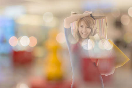 double exposure of shopping woman in the mall.の写真素材