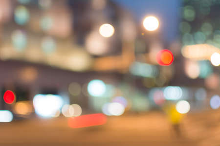 Abstract urban background with blurred buildings and street, shallow depth of focus.の写真素材