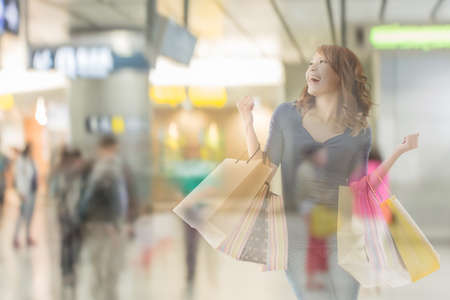 double exposure of shopping woman in the mall.の写真素材
