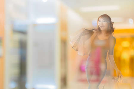 double exposure of shopping woman in the mall.の写真素材