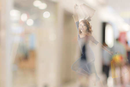 double exposure of shopping woman in the mall.の写真素材