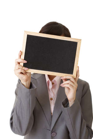 Asian business woman holding blank blackboard on white background.の写真素材
