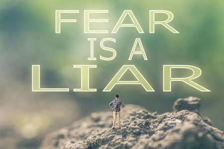 Concept of  with a person stand in the outdoor and looking up the text over the sky in nature background.の写真素材