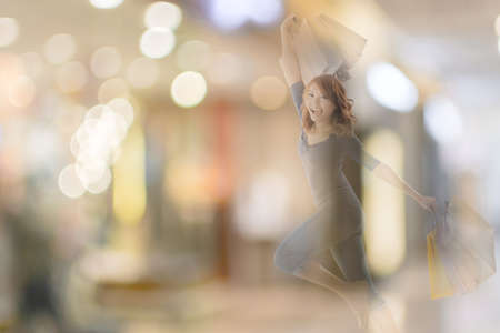 double exposure of shopping woman in the mall.の写真素材