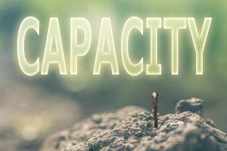 Concept of ability with a person stand in the outdoor and looking up the text over the sky in nature background.の写真素材