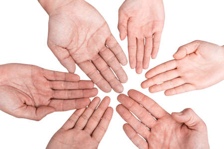Group of hands holding together on white background.