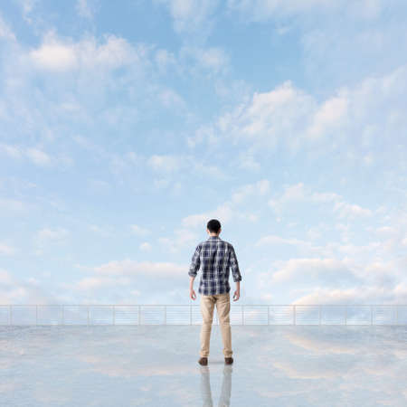 Man look and discover against the cloudy sky with copyspace.