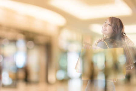 double exposure of shopping woman in the mall.の写真素材