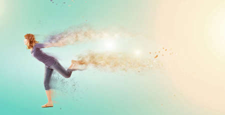 Excited Asian woman dancing with copyspace.の写真素材