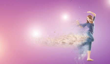 Excited Asian woman dancing with copyspace.の写真素材