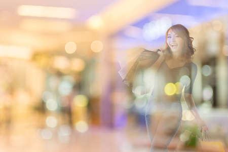 double exposure of shopping woman in the mall.の写真素材