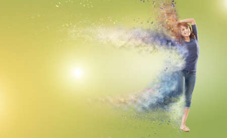 Excited Asian woman dancing with copyspace.の写真素材