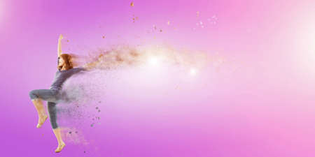 Excited Asian woman dancing with copyspace.の写真素材