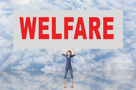 Woman holding card with text on it against the sky.の写真素材